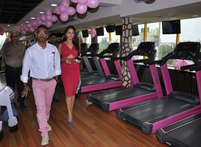 (L-R) Mr. V. Mathi, Neetu Chandra with the pink treadmills